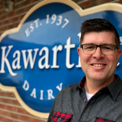 Brian Kerr in front of Kawartha Dairy sign