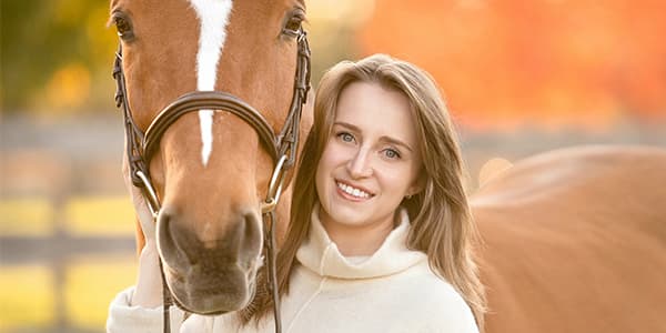 Katie Blum posing with a horse